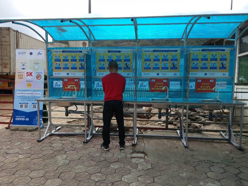 Handwash station with posters about hand-washing steps installed at POE in Ha Tinh. Photo by IOM Viet Nam